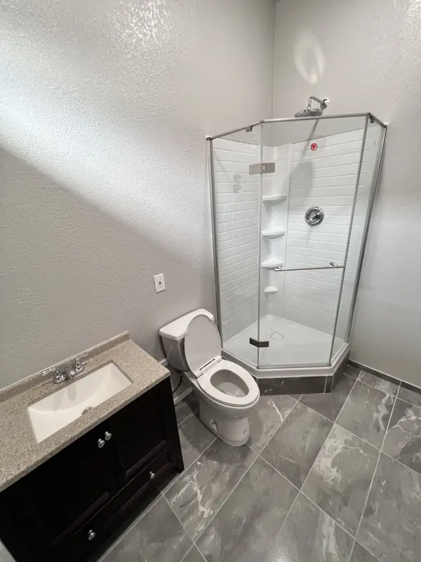Full bathroom added inside a garage conversion