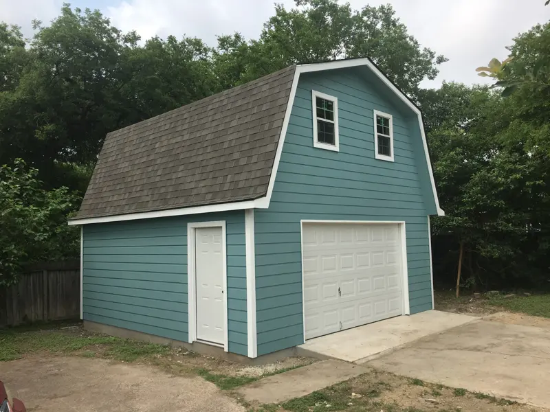 Two-story gambrel barn garage with loft windows