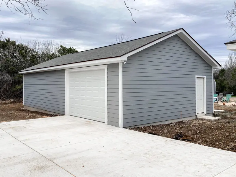 Gray single-bay detached garage on a new slab
