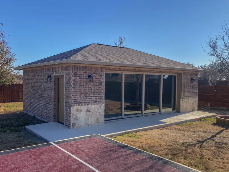 Detached garage home gym with glass walls
