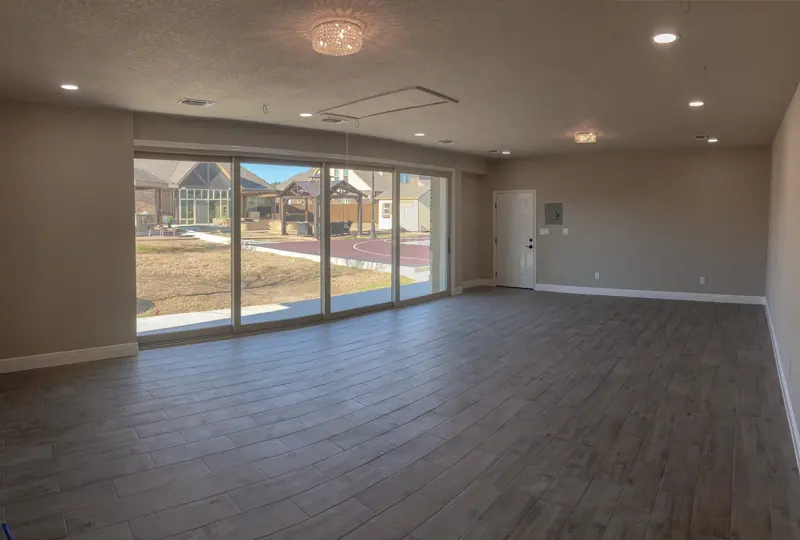Finished home gym interior with wood-look flooring