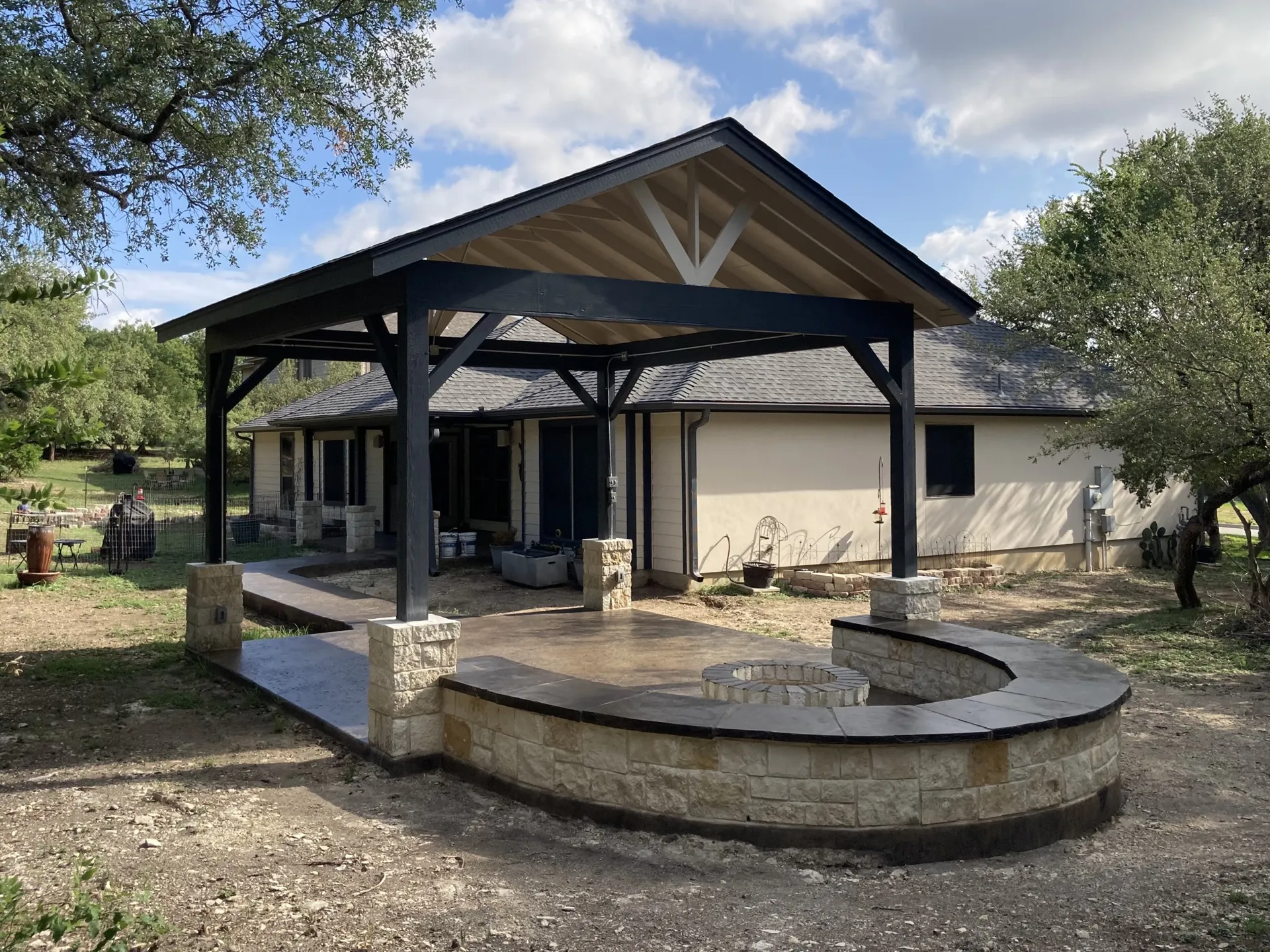 Pavilion with built-in outdoor kitchen and bar seating