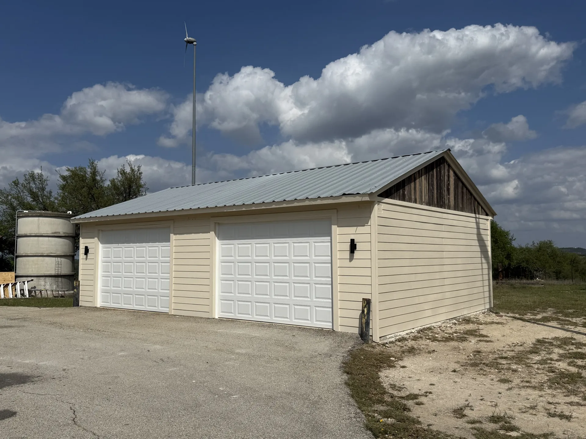 Multi-bay shop with metal roof and cedar gable accent