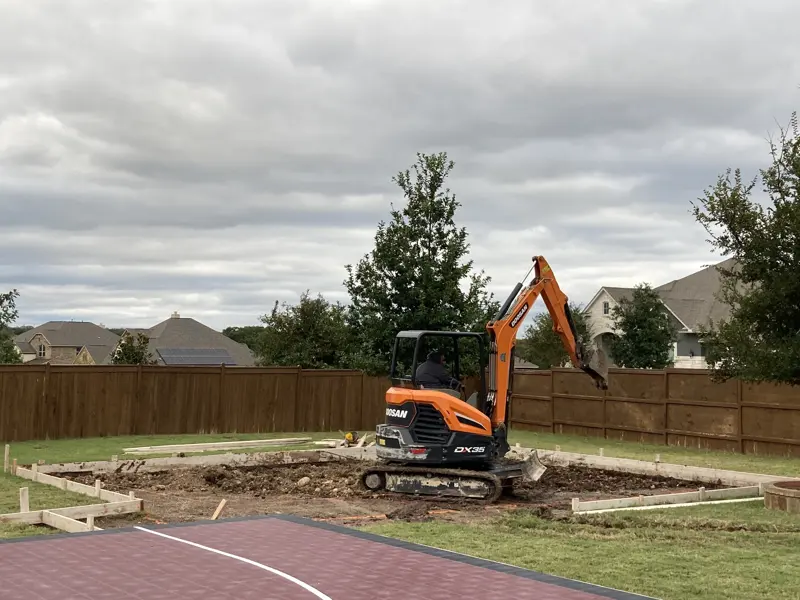 Site preparation and grading with a mini excavator