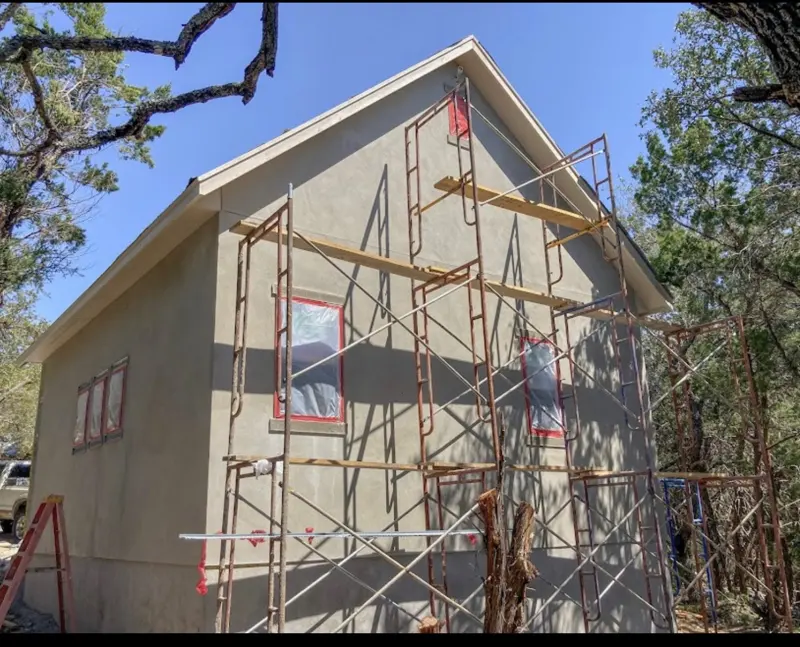 Stucco application on a two-story custom build